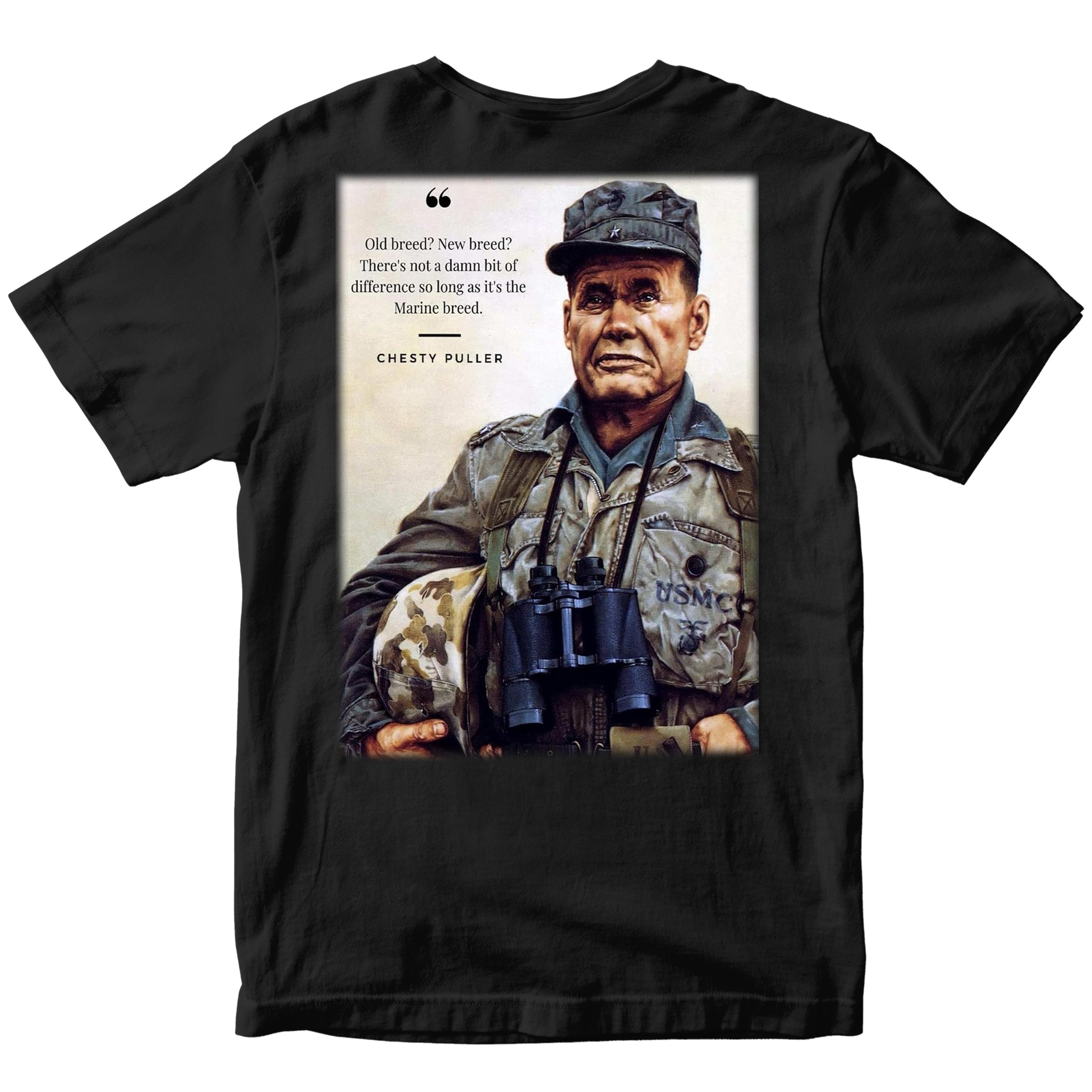 Marines black T‑shirt showing a color portrait of Lt. Gen. Chesty Puller holding a helmet and binoculars, with the quote ‘Old breed? New breed? There’s not a damn bit of difference so long as it’s the Marine breed.’ and ‘Chesty Puller’ below.”