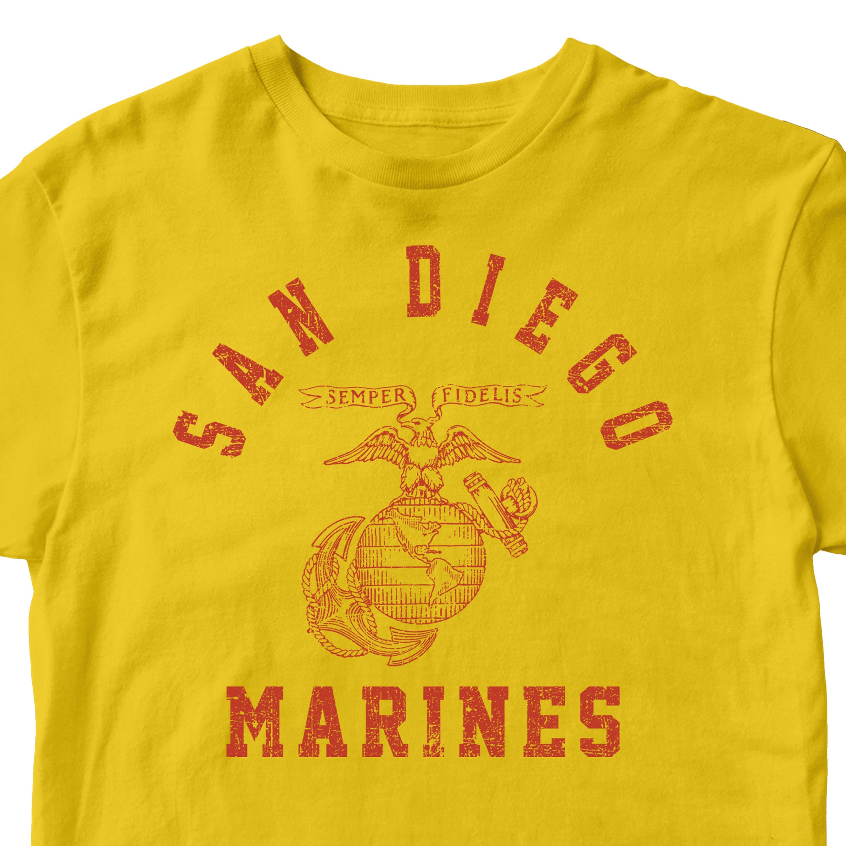 USMC gold t-shirt with distressed red print featuring 'San Diego' arched above the Eagle, Globe, and Anchor emblem, and 'Marines' text below—designed in the style of vintage Marine Corps training shirts from MCRD San Diego.