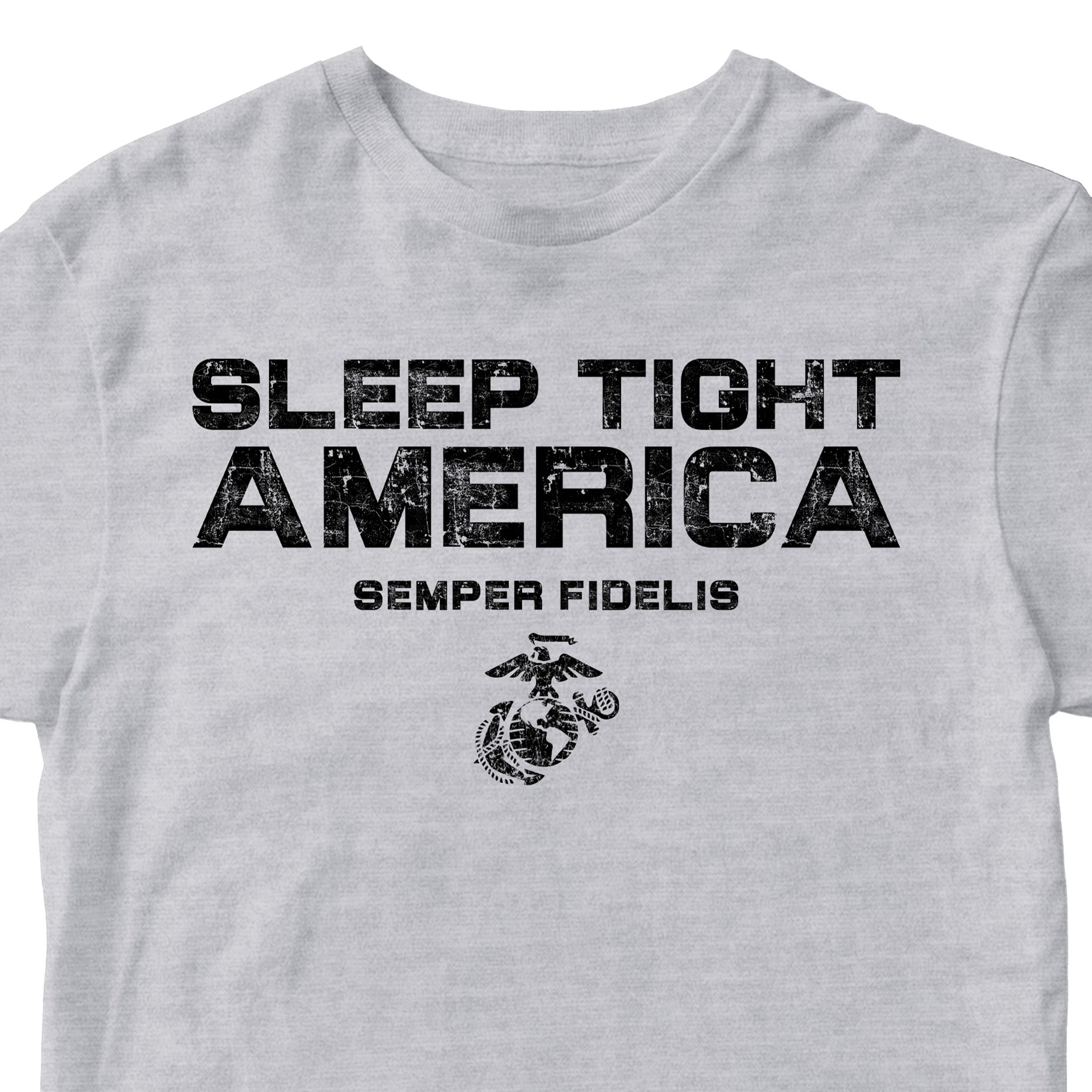 Grey USMC t-shirt with distressed black text 'Sleep Tight America,' 'Semper Fidelis,' and the Eagle, Globe, and Anchor emblem, honoring Marines who protect freedom.