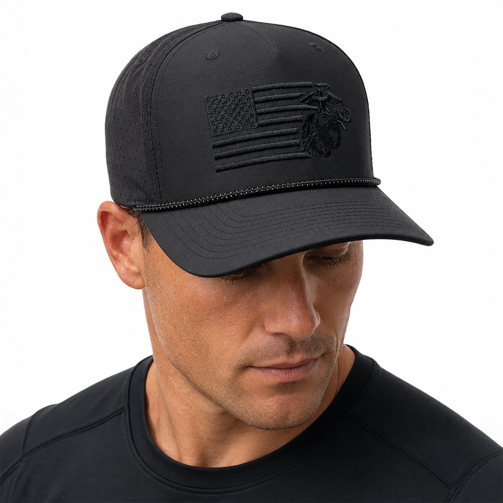 Black USMC laser perforated performance rope cap with black-on-black embroidered split American flag and Eagle, Globe, and Anchor design on the front. Marine Corps Cover. USMC black hat