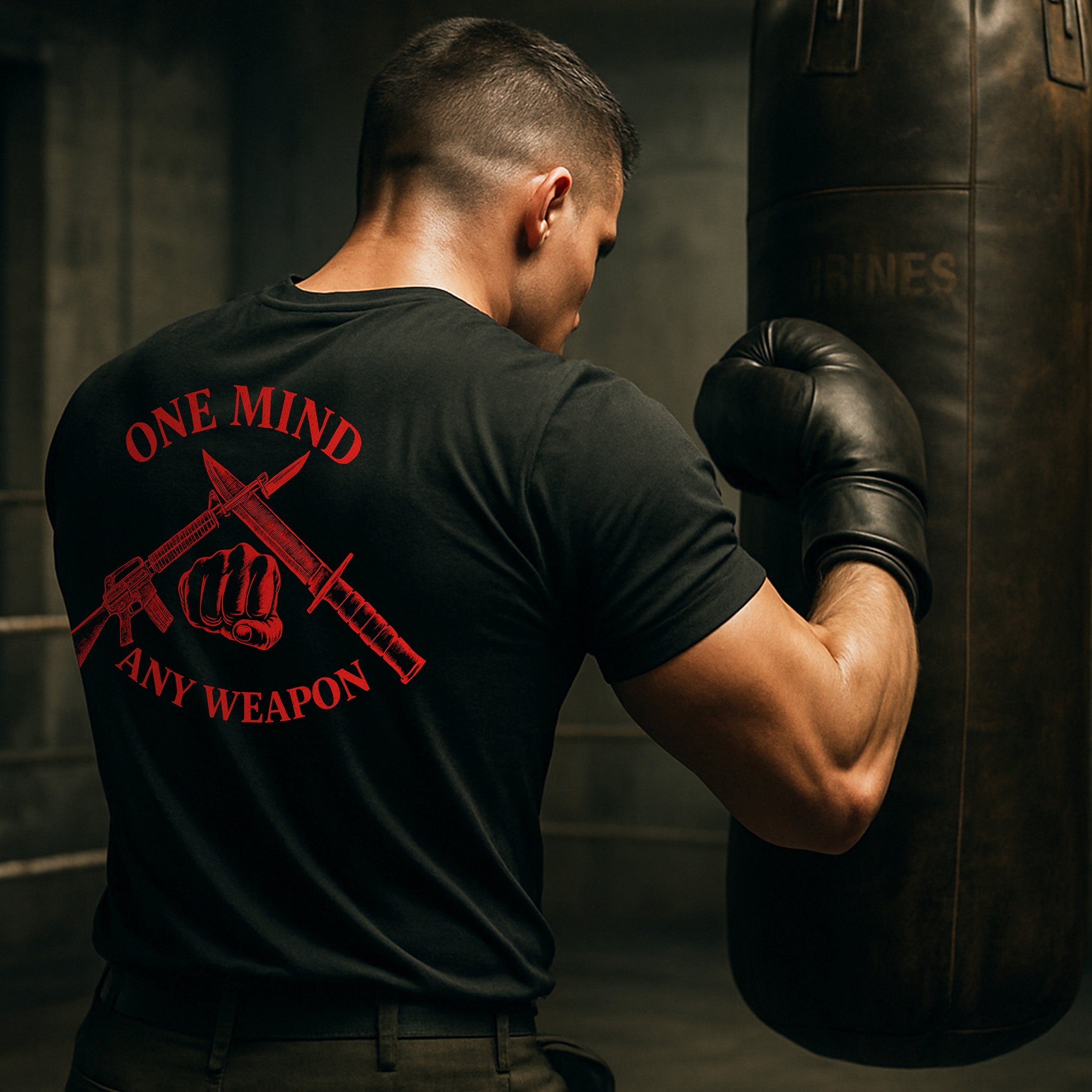 Black Marines Fight Club T-shirt with left-chest USMC Eagle Globe and Anchor and back graphic reading ‘One Mind Any Weapon’ with crossed riffle and knife and clenched fist.