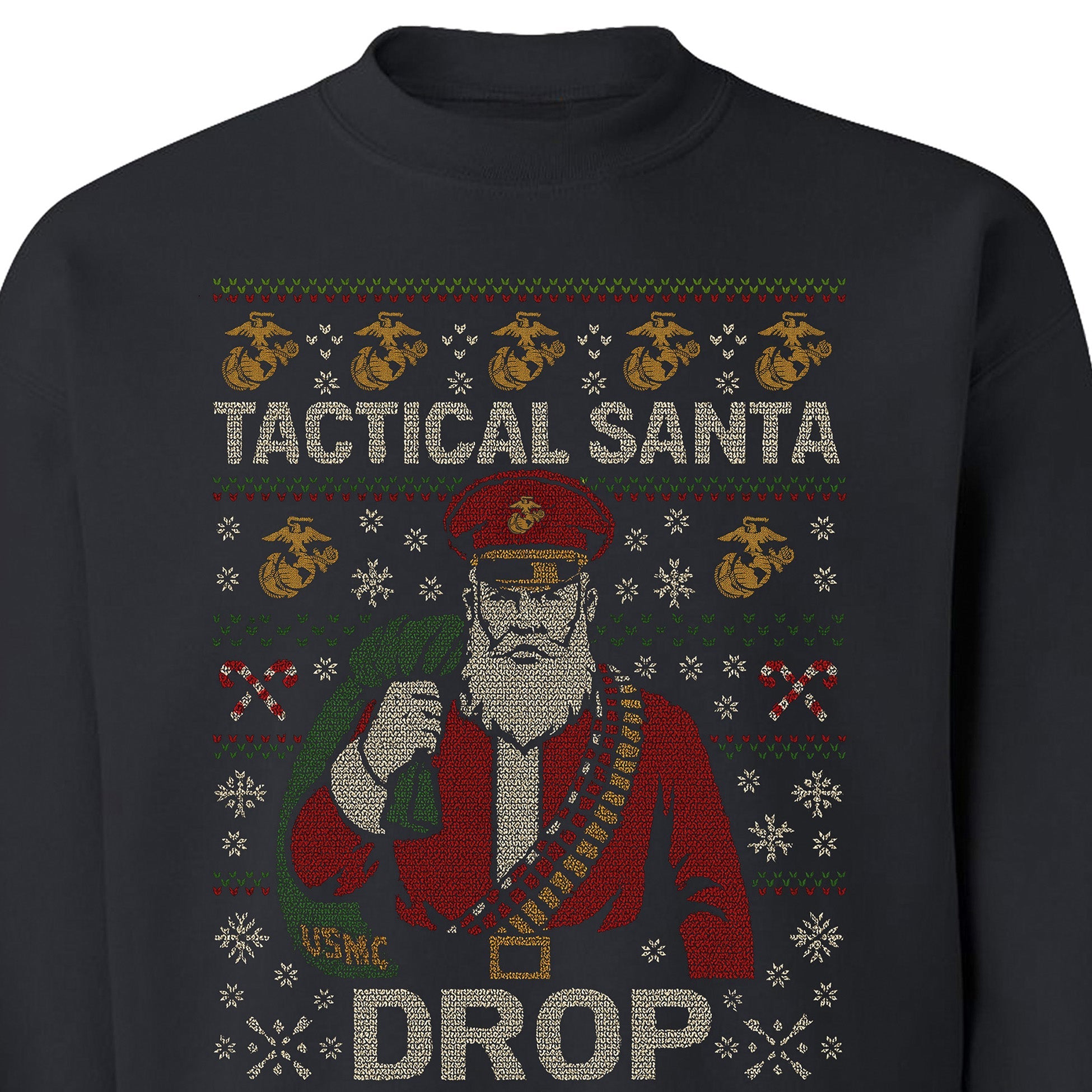Black USMC Christmas sweatshirt featuring stitched-style Tactical Santa in red uniform with ammo belt, USMC seabag, snowflakes, candy cane patterns, and bold text ‘Tactical Santa Drop.’ Marines Christmas Sweatshirt