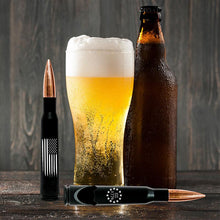 Load image into Gallery viewer, .50 Caliber Real Bullet Bottle Opener With The American Flag And Black Matte Casing Displayed with beer on table.
